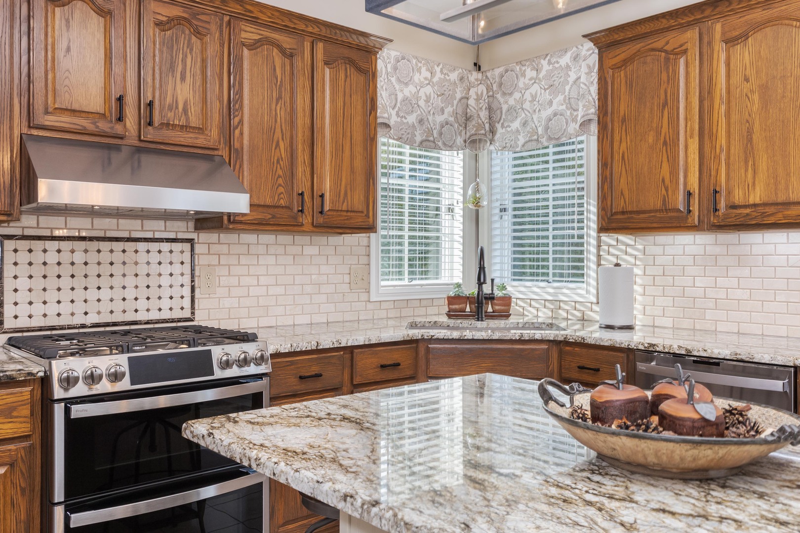 2006 Woodbine Road Bloomington, IL 61704 - Photo 42 of 98 a kitchen with a stove a sink and a cabinets