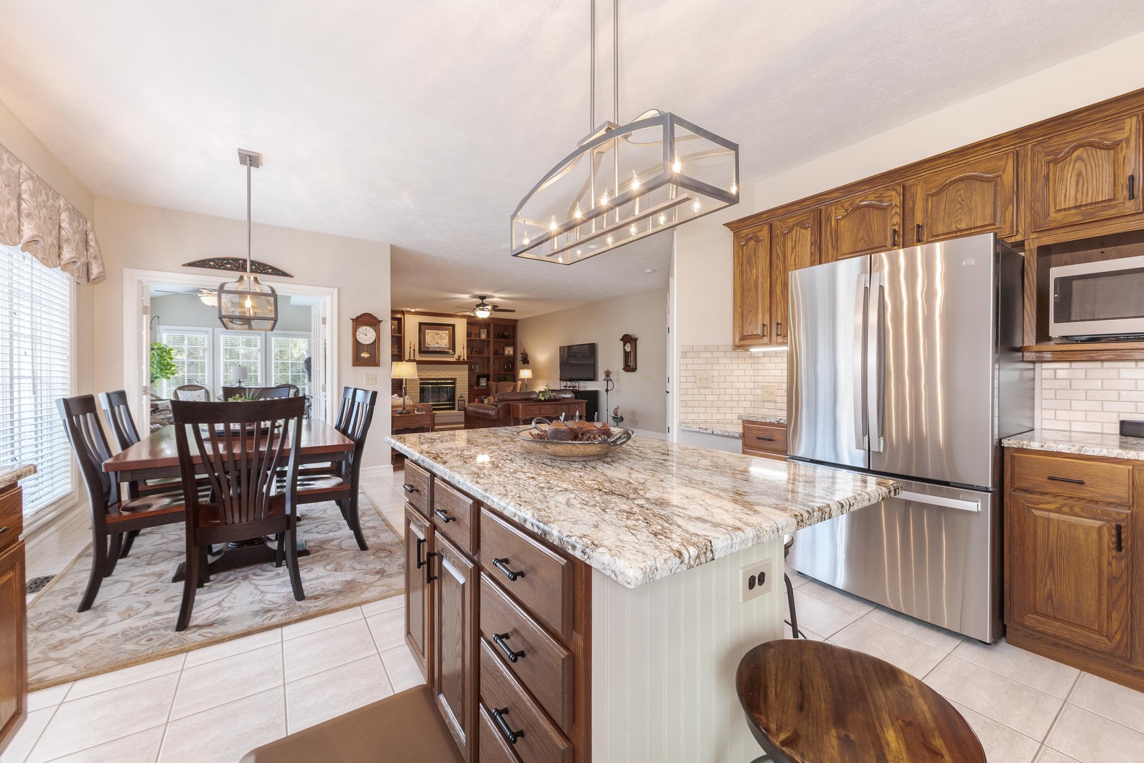 2006 Woodbine Road Bloomington, IL 61704 - Photo 44 of 98 a kitchen with stainless steel appliances granite countertop a sink stove and refrigerator
