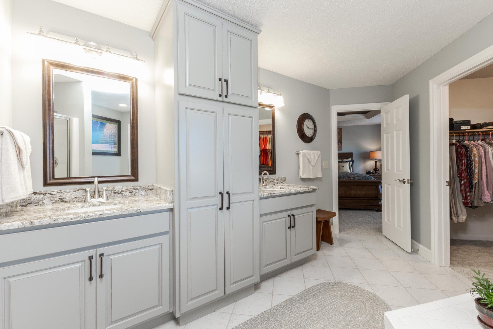 2006 Woodbine Road Bloomington, IL 61704 - Photo 53 of 98 a spacious bathroom with a granite countertop sink and a mirror
