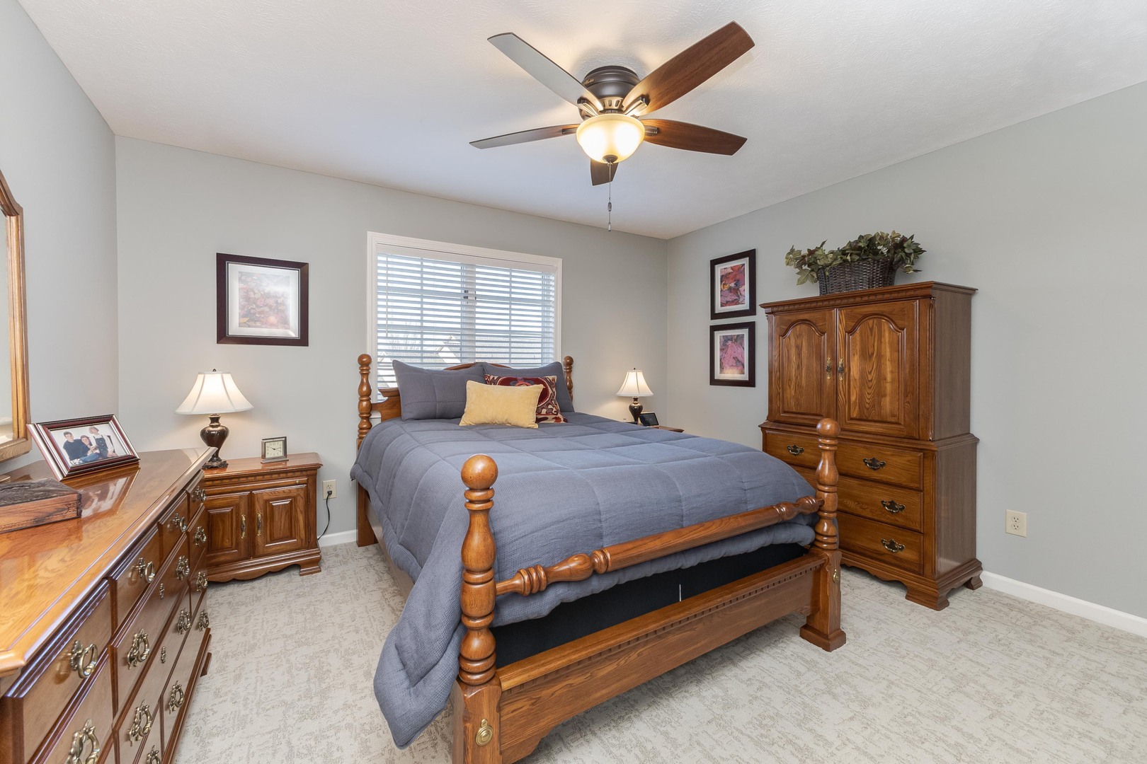 2006 Woodbine Road Bloomington, IL 61704 - Photo 60 of 98 a bedroom with a bed and a chandelier