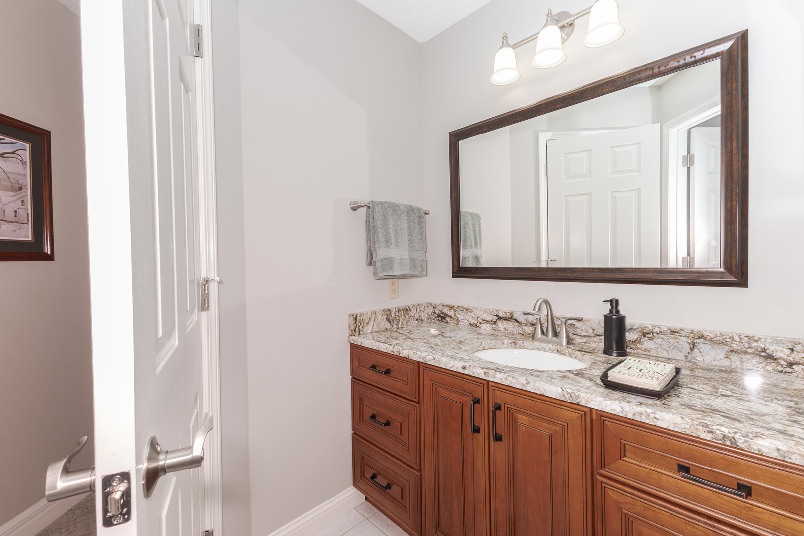 2006 Woodbine Road Bloomington, IL 61704 - Photo 63 of 98 a bathroom with a granite countertop double vanity sink and a mirror