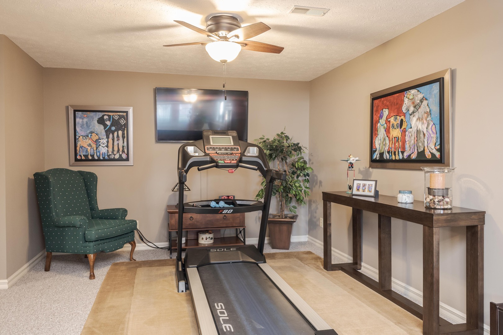2006 Woodbine Road Bloomington, IL 61704 - Photo 70 of 98 a living room with furniture and a flat screen tv