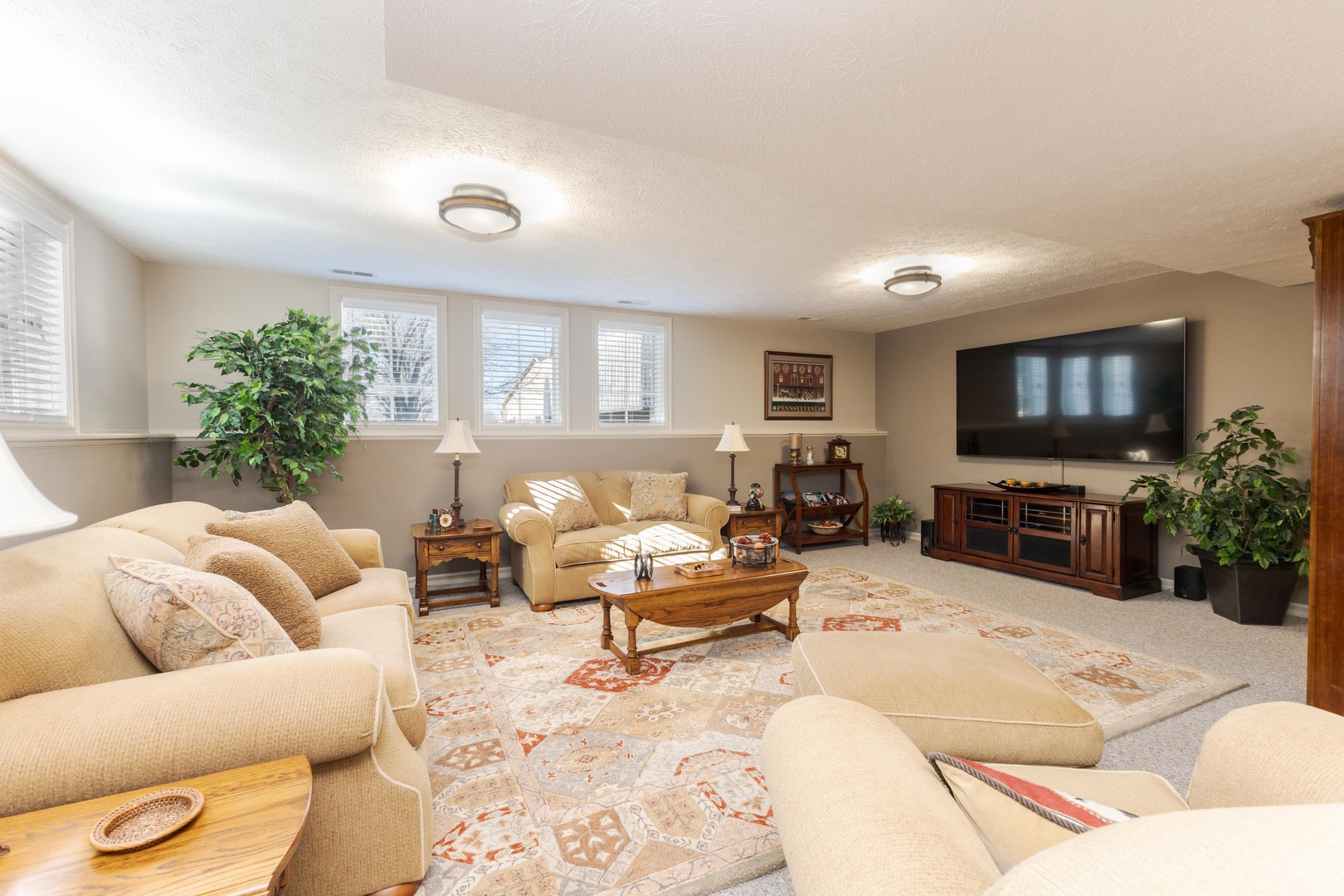 2006 Woodbine Road Bloomington, IL 61704 - Photo 72 of 98 a living room with furniture and a flat screen tv