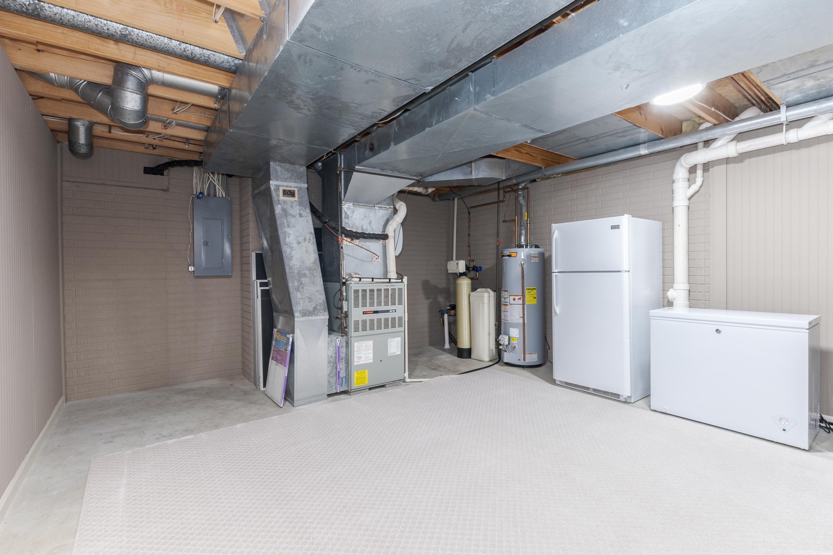 2006 Woodbine Road Bloomington, IL 61704 - Photo 76 of 98 a view of a storage & utility room with a fridge