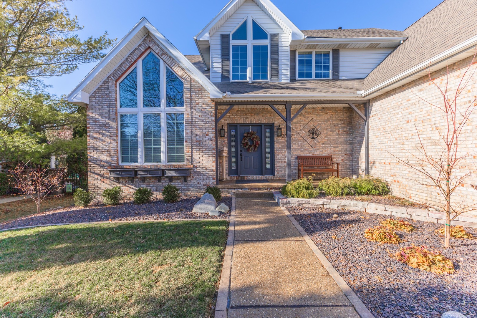 2006 Woodbine Road Bloomington, IL 61704 - Photo 83 of 98 a front view of a house with garden