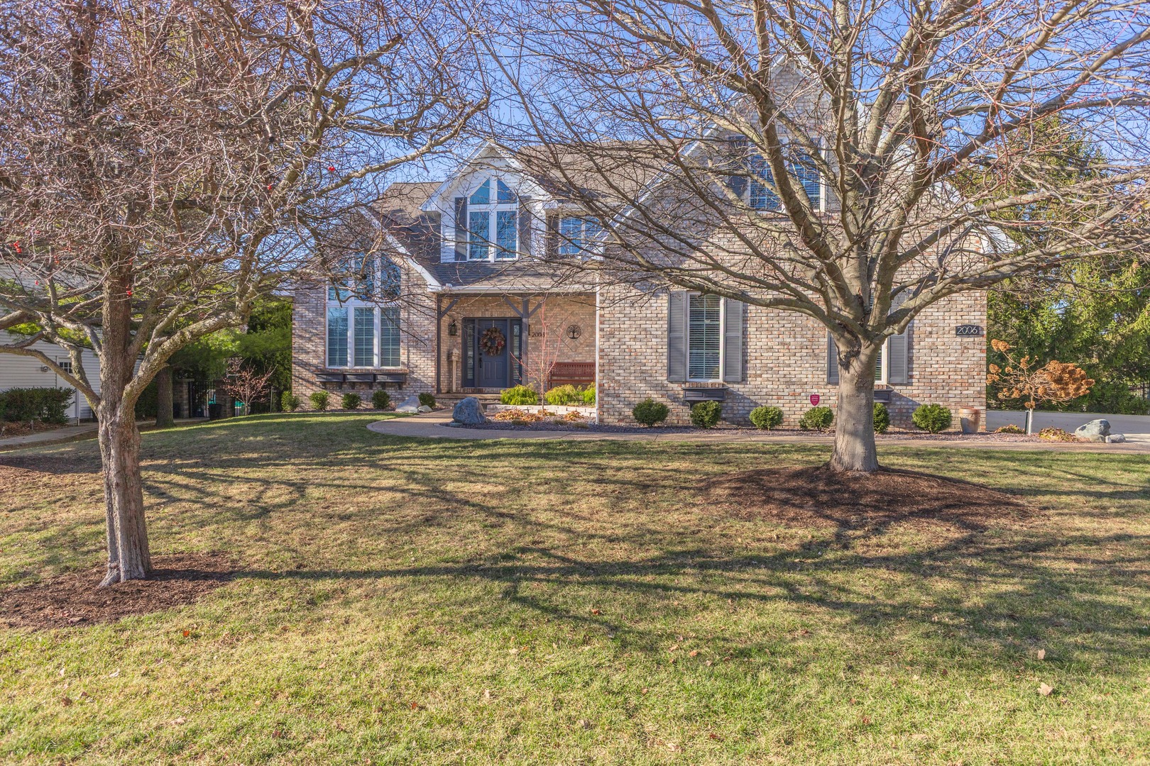 2006 Woodbine Road Bloomington, IL 61704 - Photo 87 of 98 a front view of a house with a yard