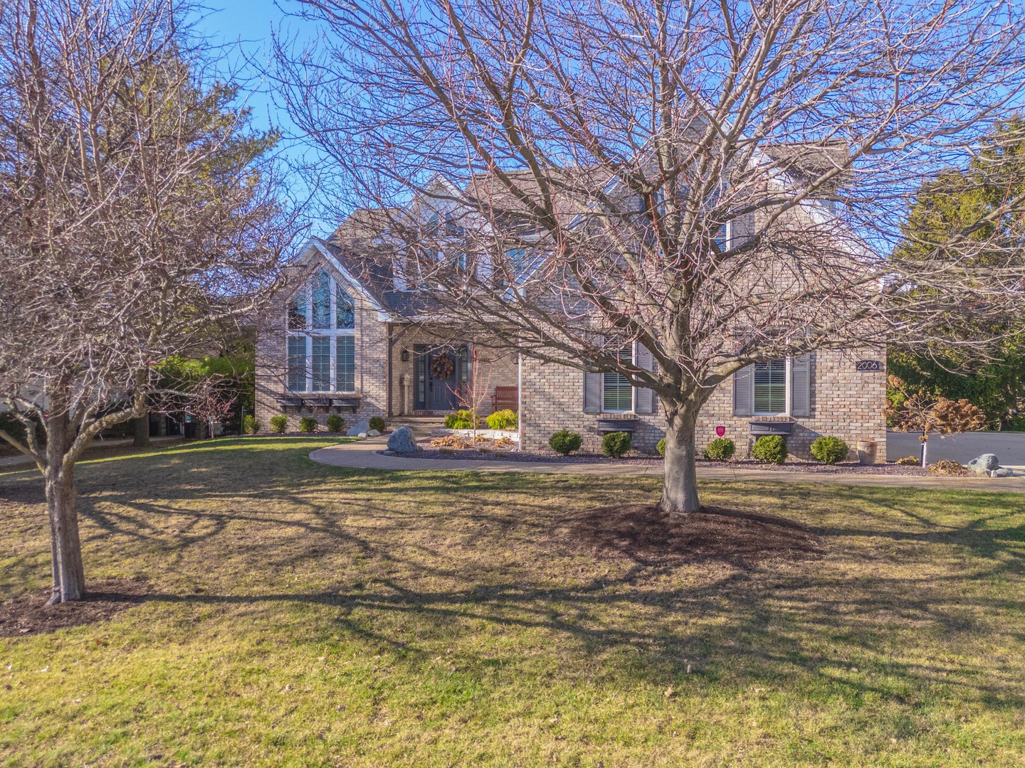 2006 Woodbine Road Bloomington, IL 61704 - Photo 98 of 98 a view of a house with a yard covered in snow