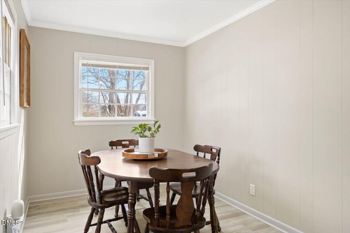1719 Lawrence Road Hillsborough, NC 27278 - Photo 11 of 24 a view of a dining room with furniture and wooden floor
