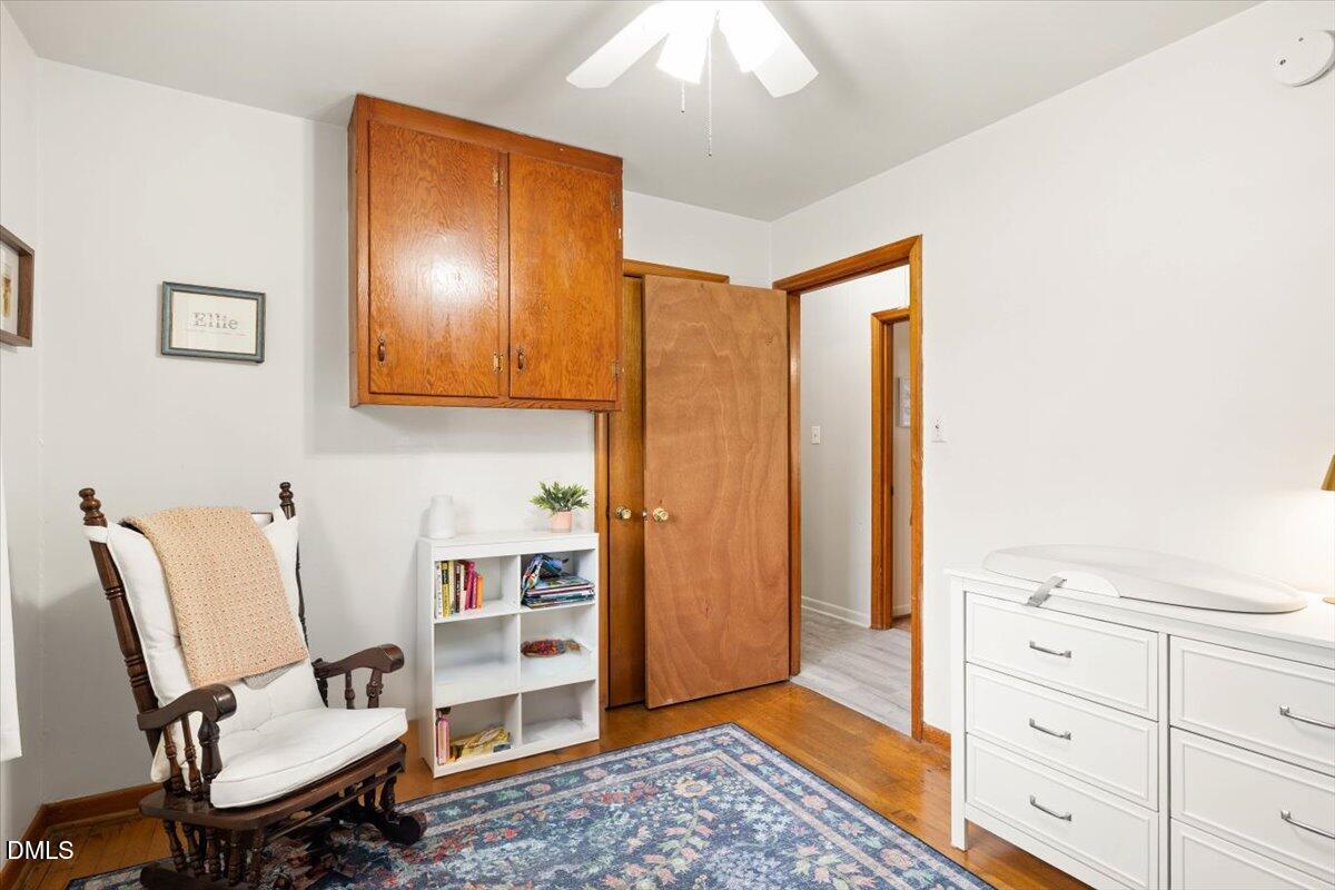 1719 Lawrence Road Hillsborough, NC 27278 - Photo 14 of 24 a view of a workspace with furniture and wooden floor