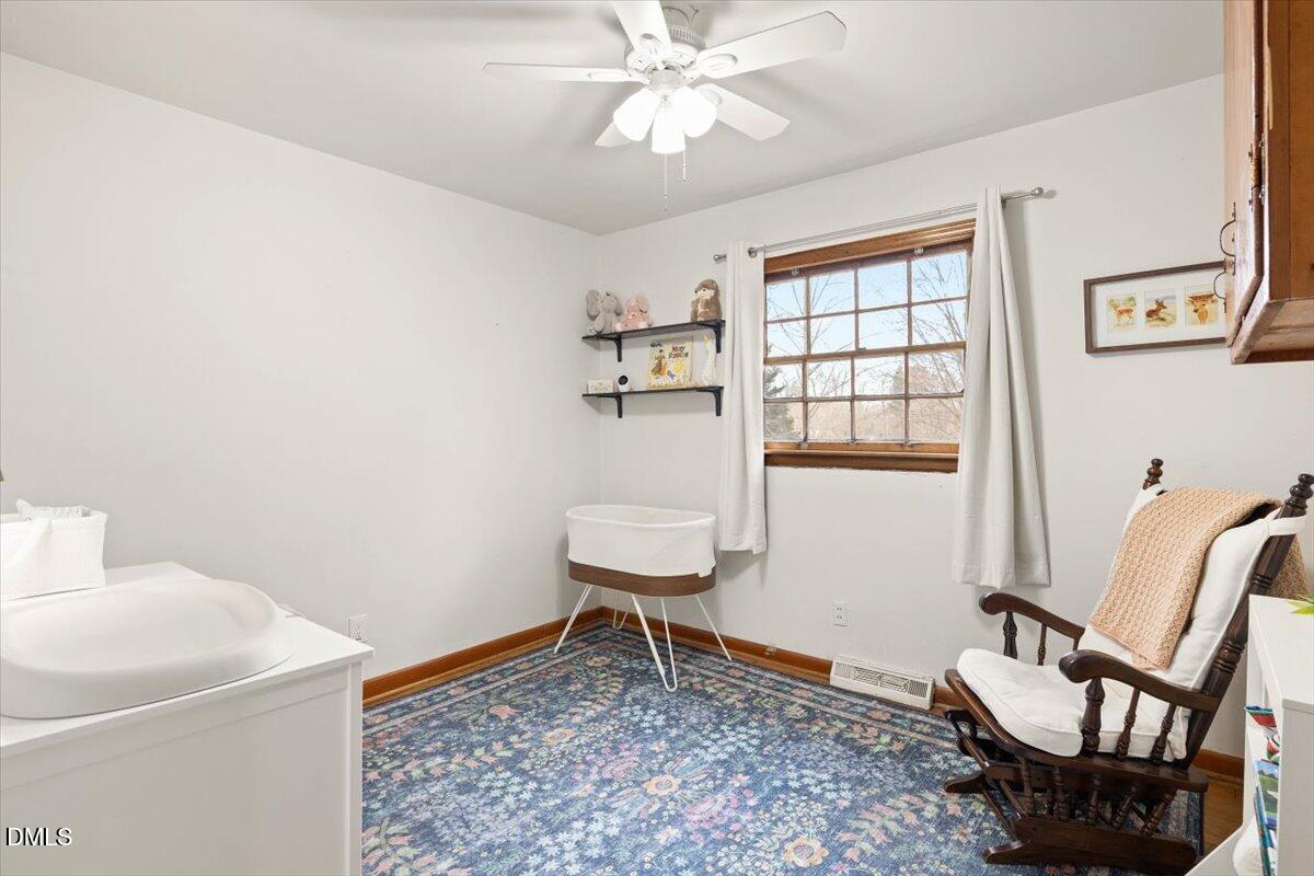 1719 Lawrence Road Hillsborough, NC 27278 - Photo 15 of 24 a living room with furniture and a window