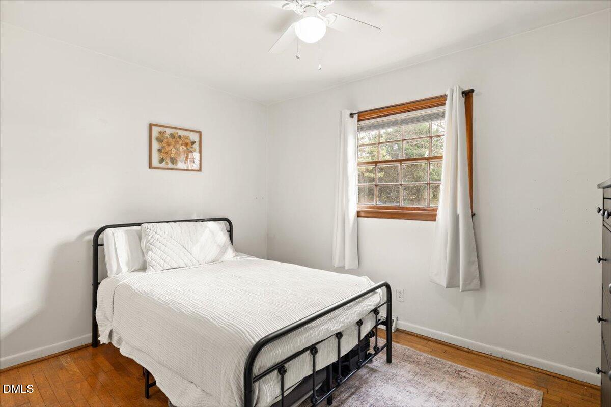 1719 Lawrence Road Hillsborough, NC 27278 - Photo 17 of 24 a bedroom with a bed and a window