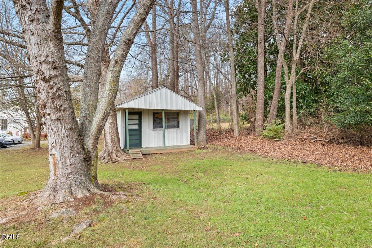 1719 Lawrence Road Hillsborough, NC 27278 - Photo 21 of 24 a front view of a house with garden