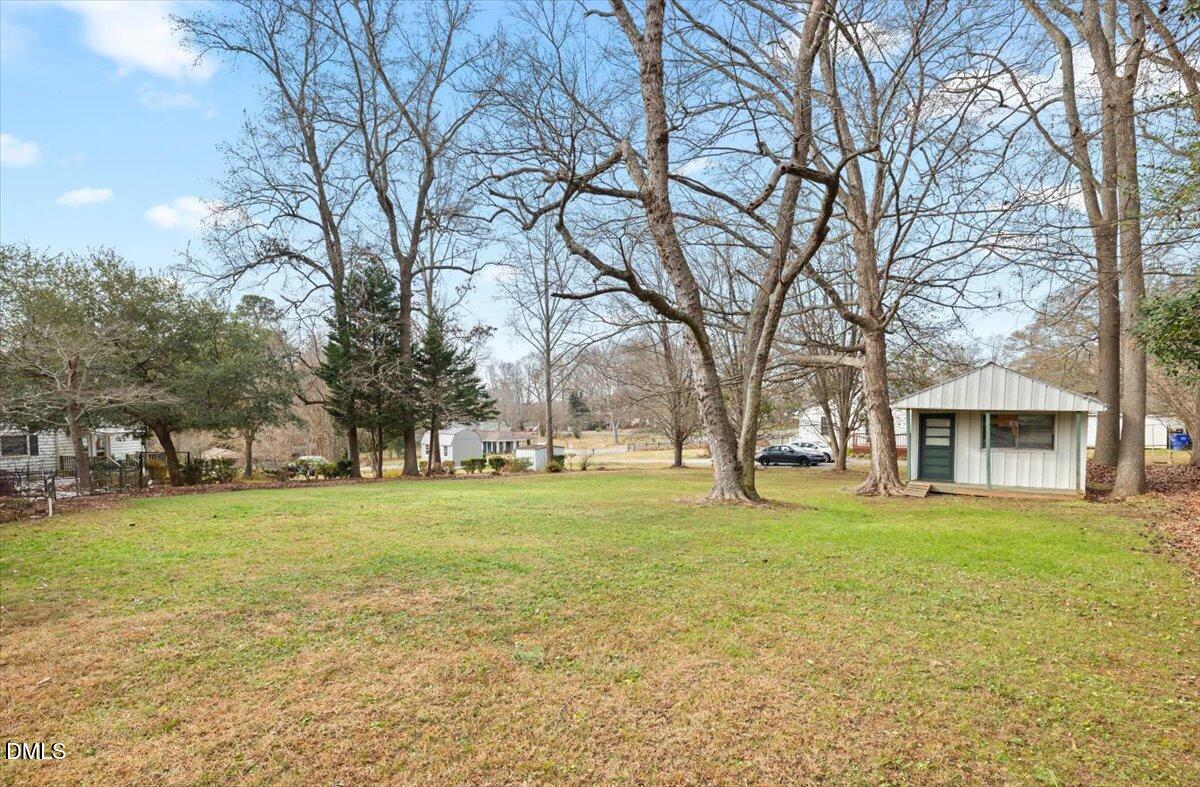 1719 Lawrence Road Hillsborough, NC 27278 - Photo 22 of 24 a view of a trees in front of a house