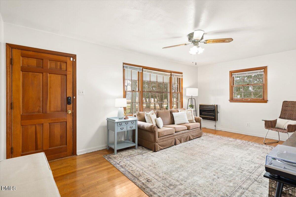 1719 Lawrence Road Hillsborough, NC 27278 - Photo 4 of 24 a living room with furniture and a window
