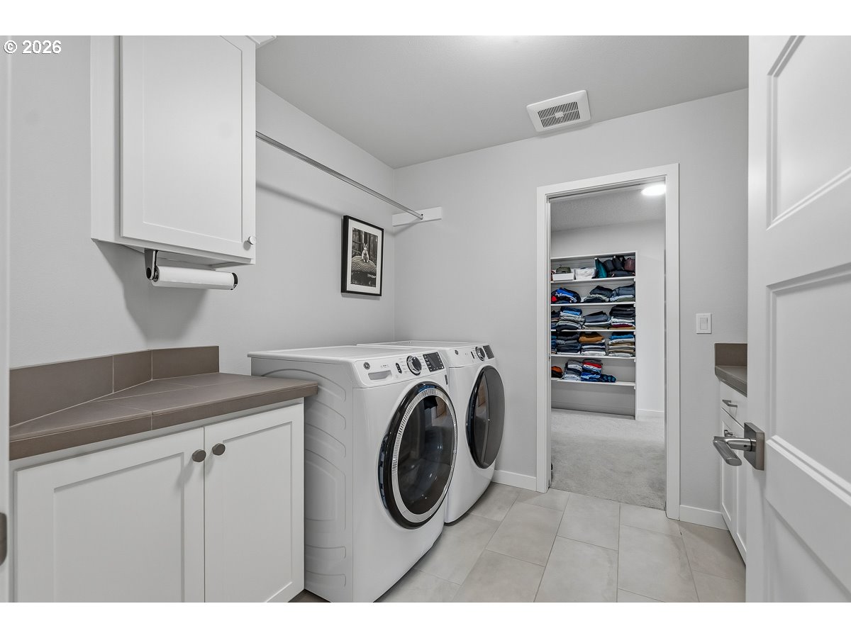 16275 Southwest Jade View Way Beaverton, OR 97007 - Photo 22 of 34 a utility room with dryer and washer