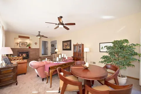 a dining room with furniture and window