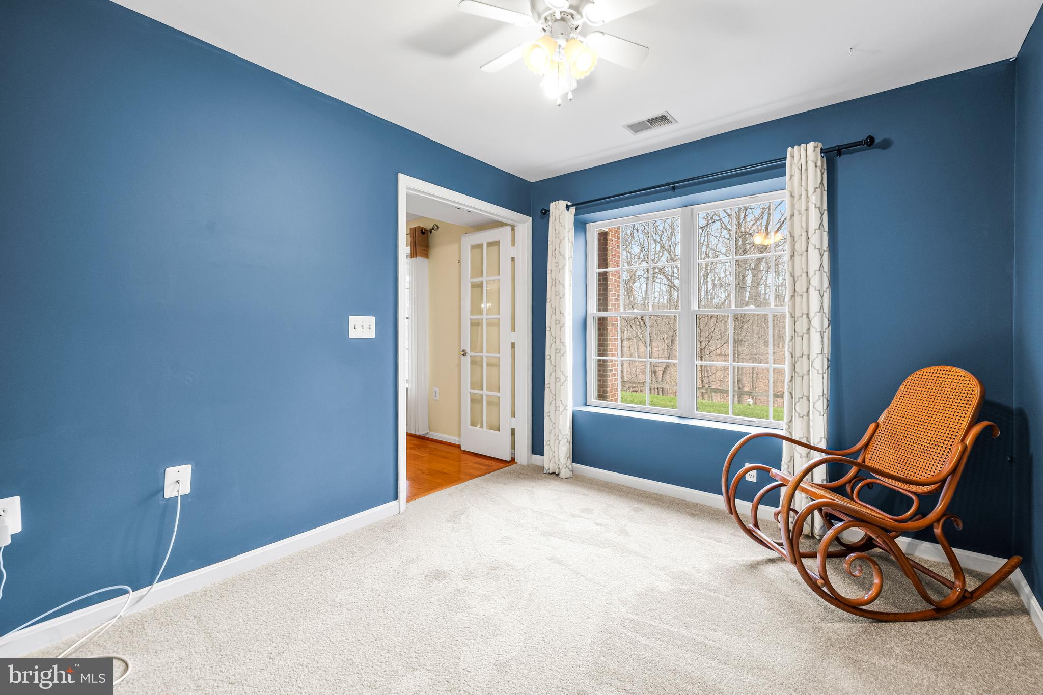 12011 Tralee Road, Unit 104 Lutherville-Timonium, MD 21093 - Photo 14 of 33 a living room with furniture and a window