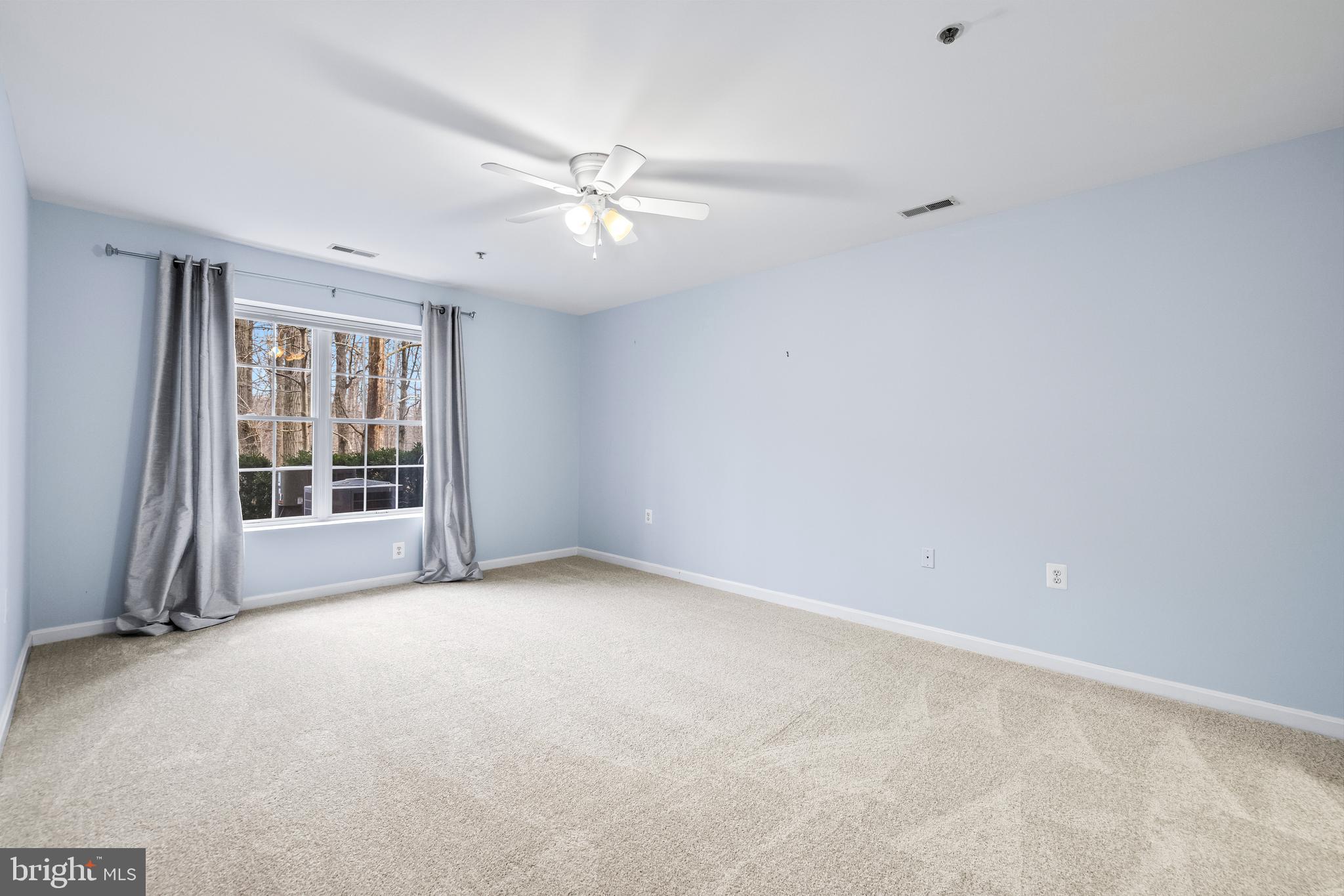 12011 Tralee Road, Unit 104 Lutherville-Timonium, MD 21093 - Photo 18 of 33 a view of an empty room with a window