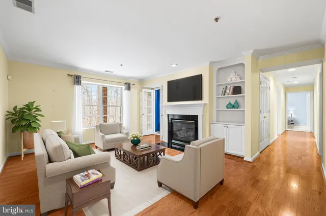 a living room with furniture flat screen tv and a fireplace
