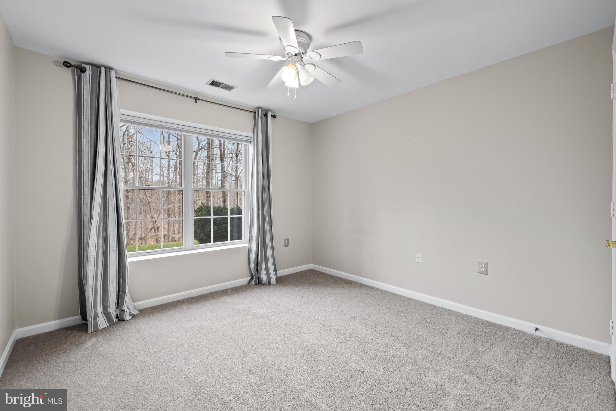 12011 Tralee Road, Unit 104 Lutherville-Timonium, MD 21093 - Photo 22 of 33 a view of an empty room with a window