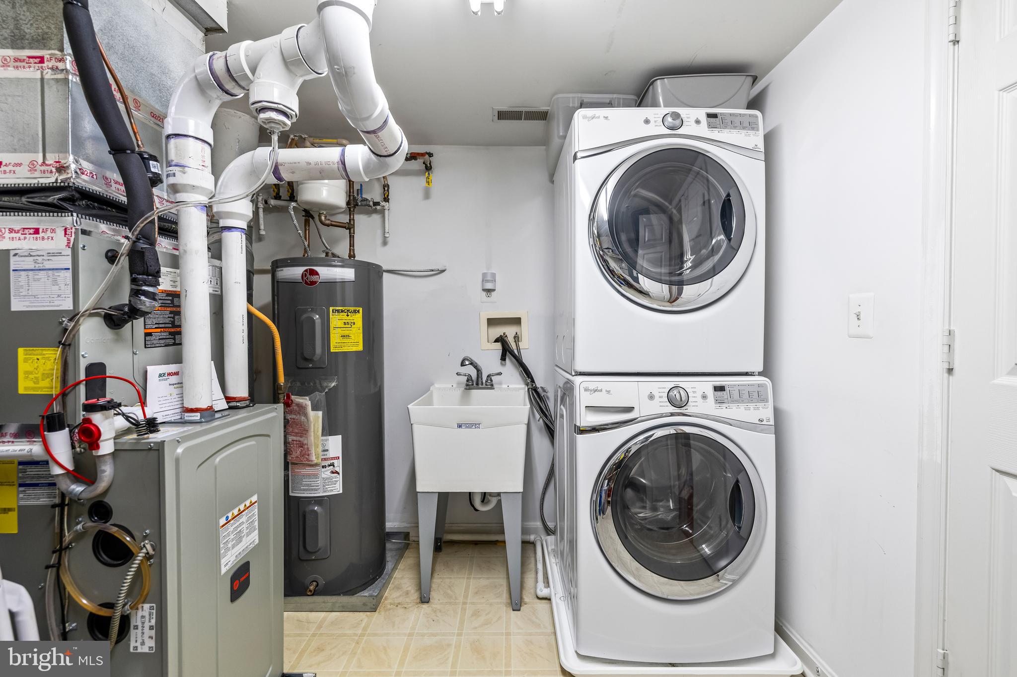 12011 Tralee Road, Unit 104 Lutherville-Timonium, MD 21093 - Photo 26 of 33 a utility room with dryer and washer