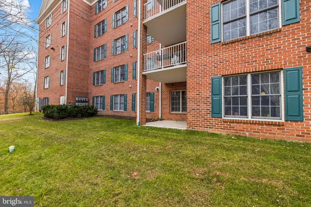 a view of a building with a yard