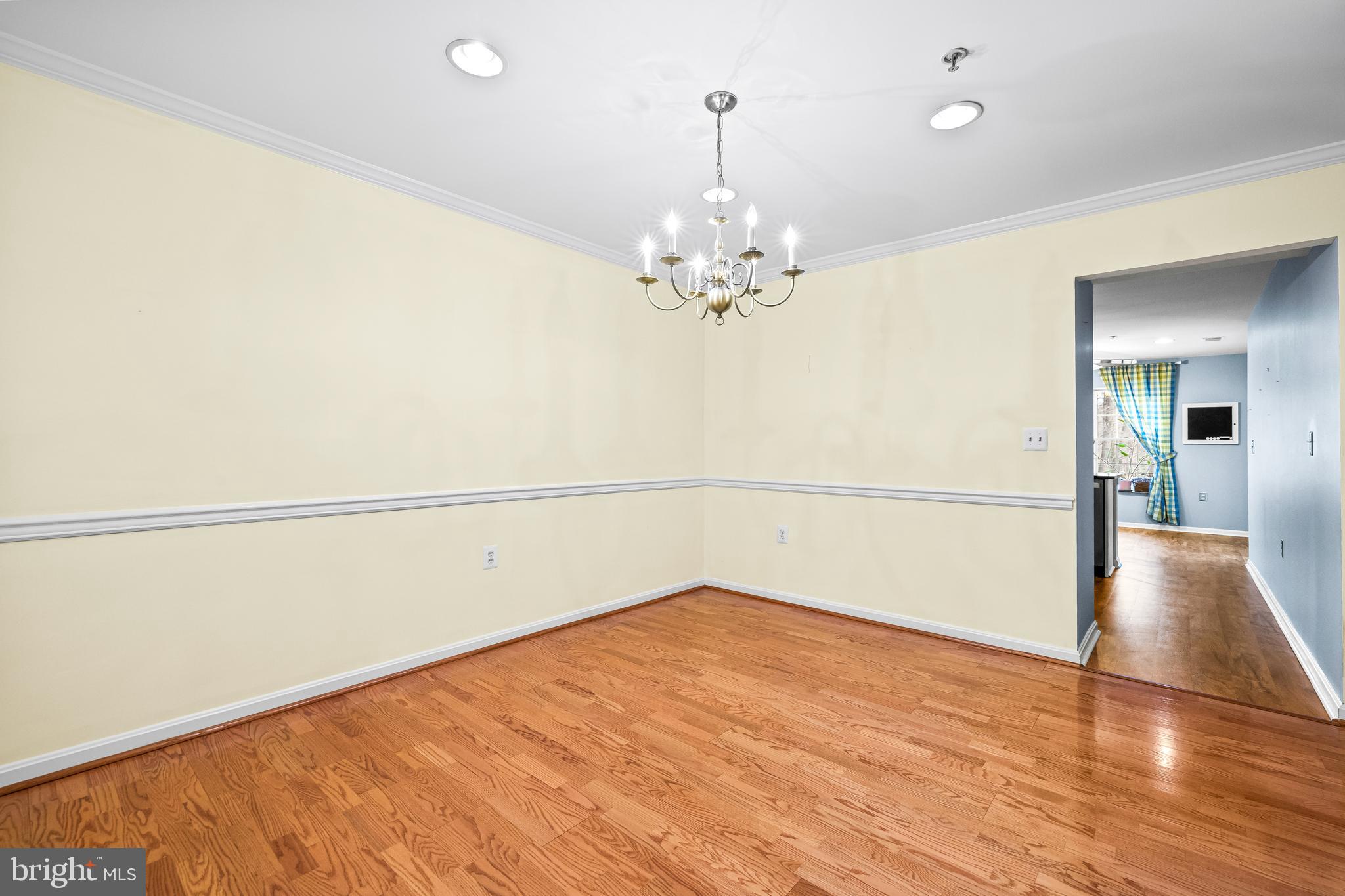 12011 Tralee Road, Unit 104 Lutherville-Timonium, MD 21093 - Photo 6 of 33 a view of an empty room with wooden floor