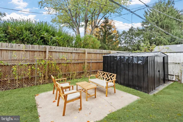 a view of a chairs and table in the yard
