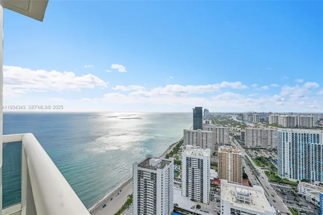 a view of a balcony with an ocean view