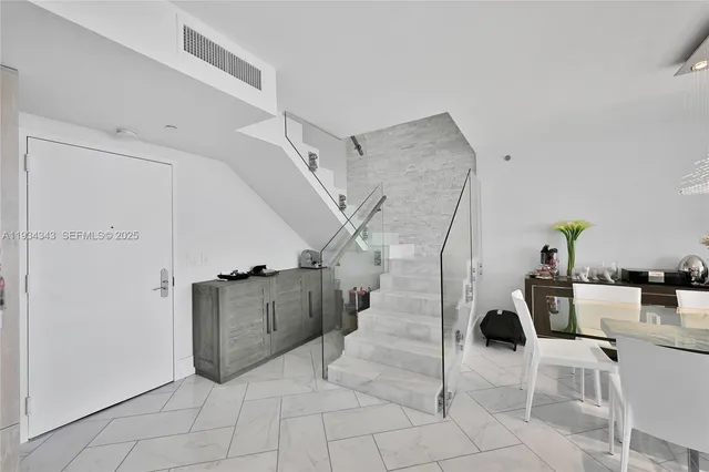 a balcony with furniture and rug