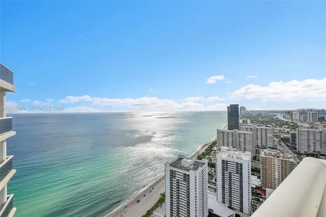 a bedroom with two beds and a large window