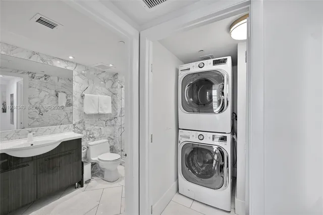 a bathroom with a sink toilet a mirror and shower