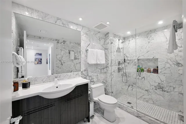 a spacious bedroom with a bed and a large window