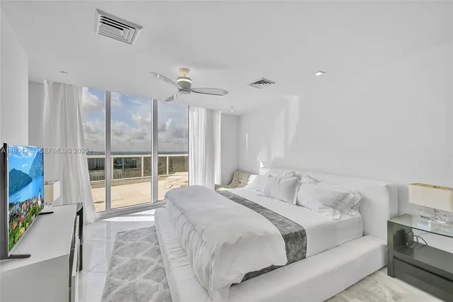 a view of backyard with roof deck