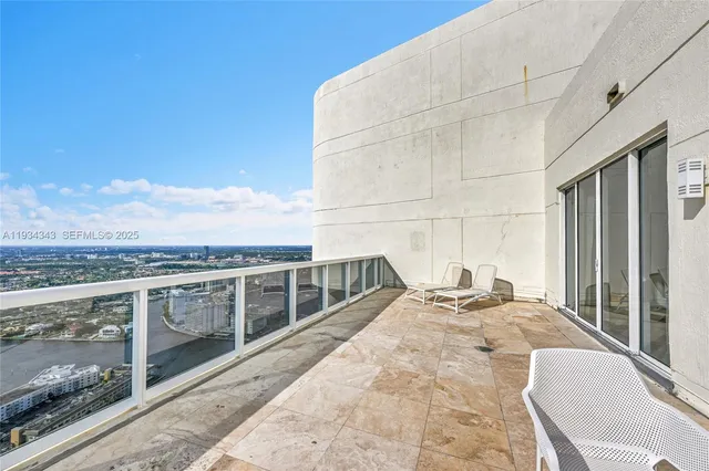 a bathroom with a shower a toilet and a sink