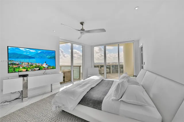 a balcony with table and chairs