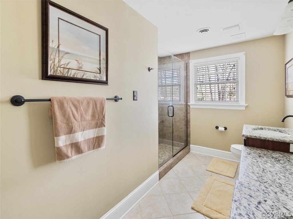 2931 West Brigstock Road Midlothian, VA 23113 - Photo 16 of 46 a bathroom with a tub shower and sink
