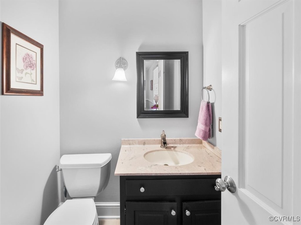 2931 West Brigstock Road Midlothian, VA 23113 - Photo 25 of 46 a bathroom with a toilet sink and mirror