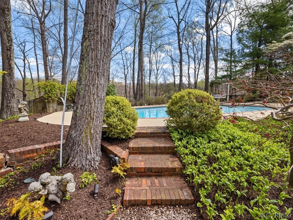 2931 West Brigstock Road Midlothian, VA 23113 - Photo 37 of 46 a view of a garden with pathway