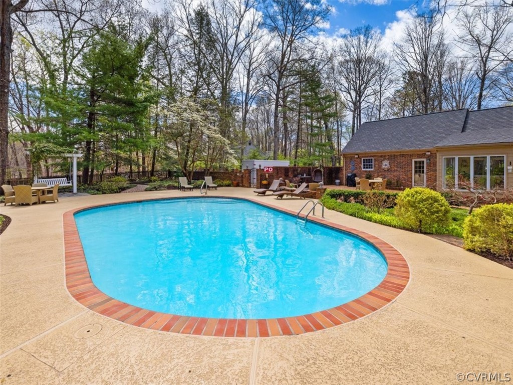 2931 West Brigstock Road Midlothian, VA 23113 - Photo 40 of 46 a view of a swimming pool with lounge chair