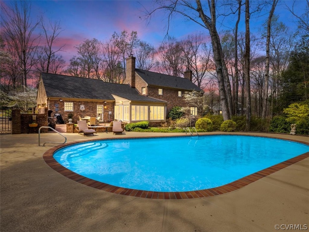 2931 West Brigstock Road Midlothian, VA 23113 - Photo 45 of 46 a view of a swimming pool with outdoor seating
