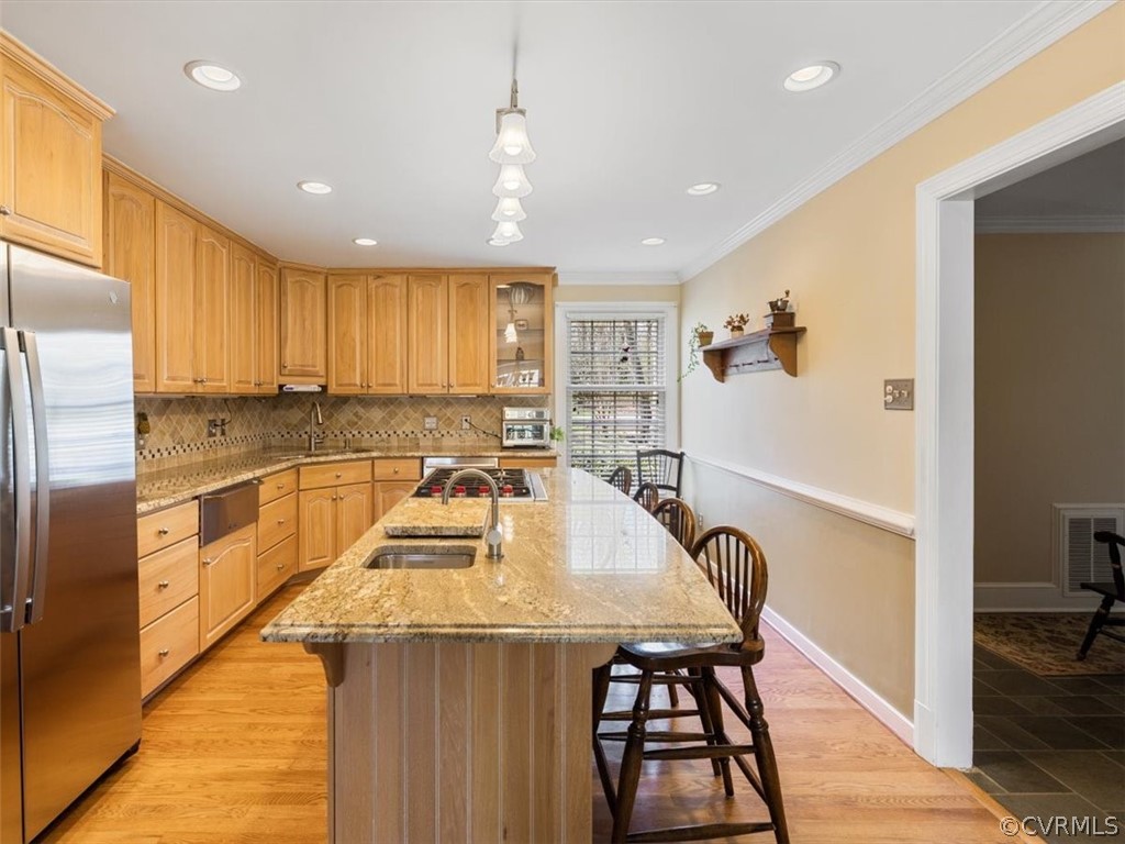 2931 West Brigstock Road Midlothian, VA 23113 - Photo 6 of 46 a kitchen with a table chairs refrigerator and cabinets