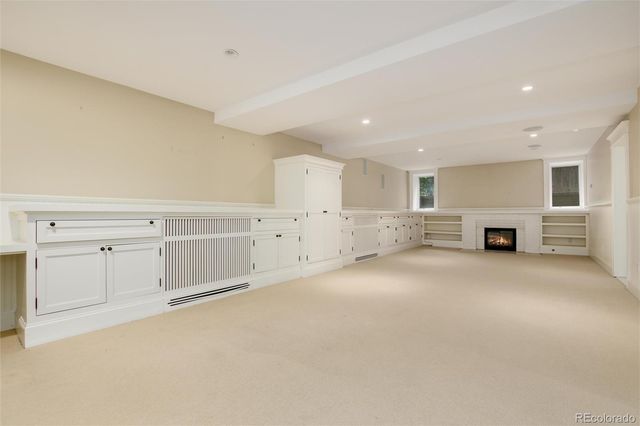 a view of a kitchen with white cabinets