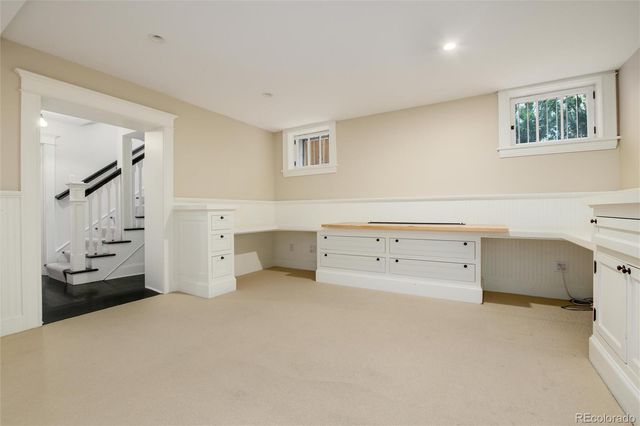 a room with a bed and a cabinets