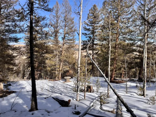a view of a backyard with sitting area