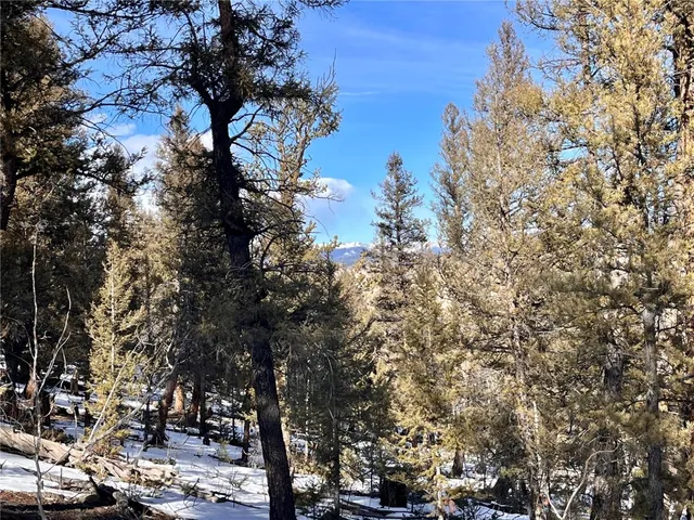 a view of outdoor space with cars parked
