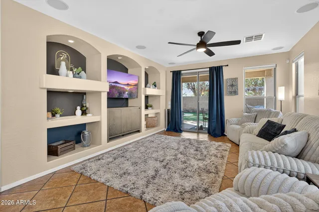 a bedroom with a bed and a table