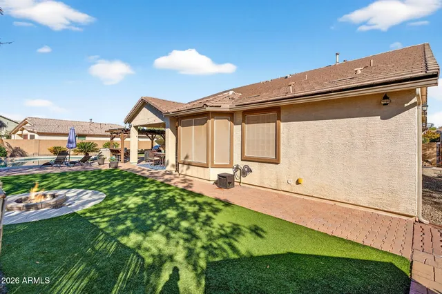 a view of a backyard with a garden and plants