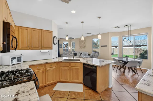 a living room with furniture wooden floor and a chandelier