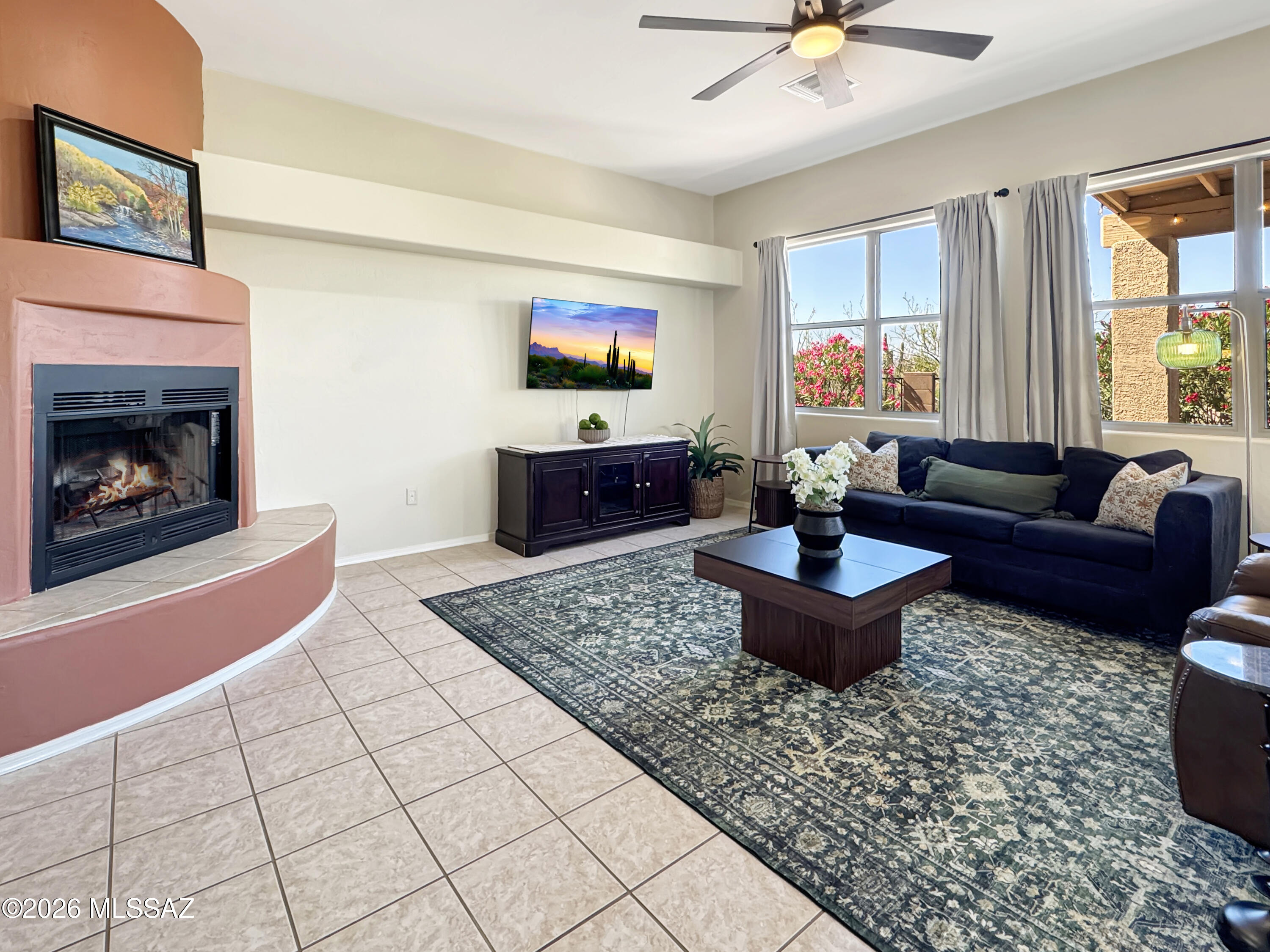 10835 South Heart Break Ridge Place Vail, AZ 85641 - Photo 11 of 49 a living room with furniture and a fireplace